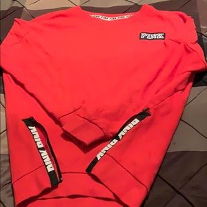 Victoria Secret sweater with zippers on the side.